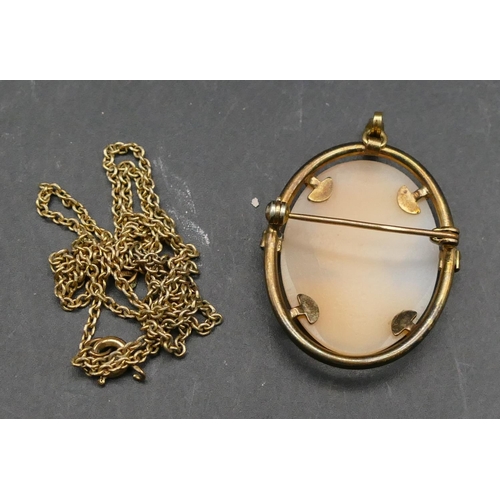 587 - A gold plated oval cameo brooch/pendant with chain, figurehead of a lady