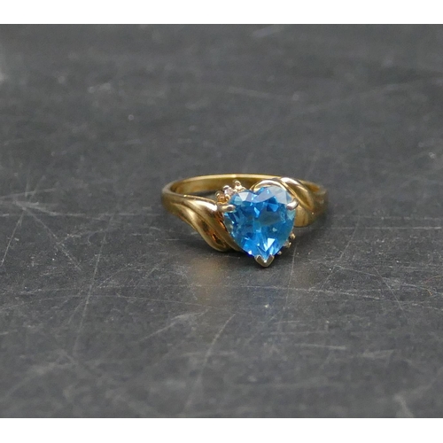 596 - A 9ct gold heart shaped blue CZ ring, Size N/O, 3.1 grams gross