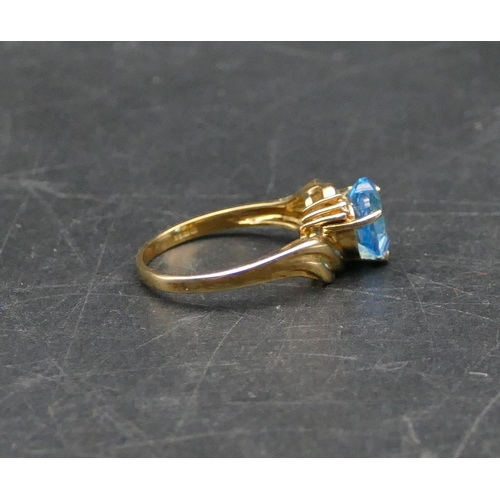 596 - A 9ct gold heart shaped blue CZ ring, Size N/O, 3.1 grams gross