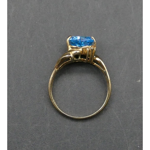 596 - A 9ct gold heart shaped blue CZ ring, Size N/O, 3.1 grams gross