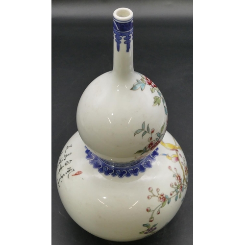 60 - An Oriental double gourd vase on white and blue ground with multi-coloured bird, branch, floral and ... 