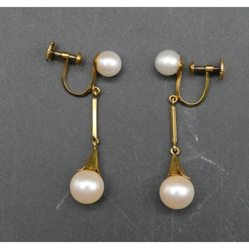 602 - A pair of pearl drop earrings with screw backs, 4cm long, 4.3 grams gross