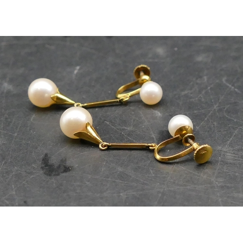 602 - A pair of pearl drop earrings with screw backs, 4cm long, 4.3 grams gross