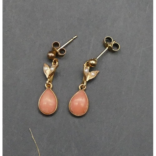 605 - A pair of small gold earrings with drop coral mounted with small half pearls