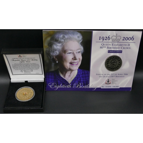 607 - A 925 sterling silver gilt Queen's 80th birthday golden crown proof, boxed, 2 other coins (3)