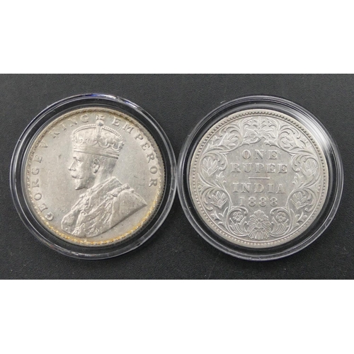 608 - A pair of silver King George V and Queen Victoria British India 1 Rupee, boxed with certificate