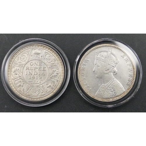 608 - A pair of silver King George V and Queen Victoria British India 1 Rupee, boxed with certificate