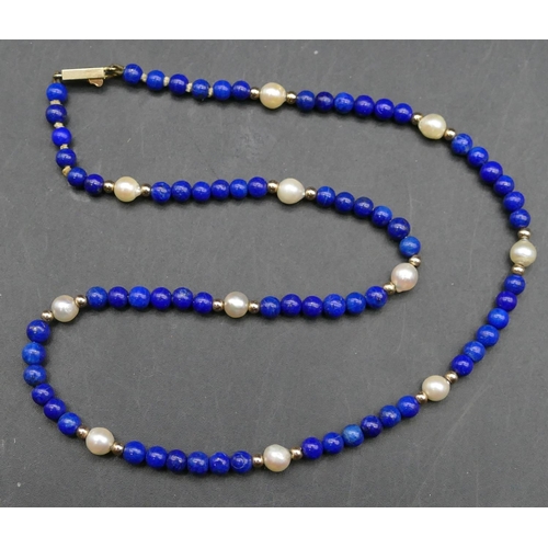 612 - A lapis lazuli and cultured pearl bead necklace with 14ct gold clasp, 39cm long