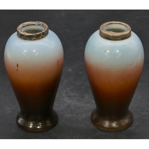 62 - A pair of china round small bulbous shaped vases with silver necks on multi-coloured ground depictin... 