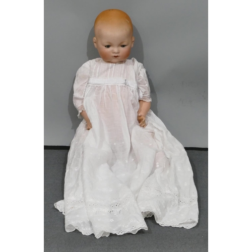 628 - Armand Marseilles porcelain headed doll with closed mouth and closable eyes, jointed body, 59cm long