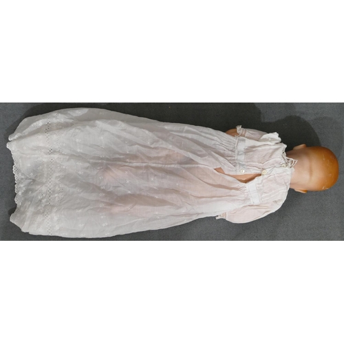 628 - Armand Marseilles porcelain headed doll with closed mouth and closable eyes, jointed body, 59cm long