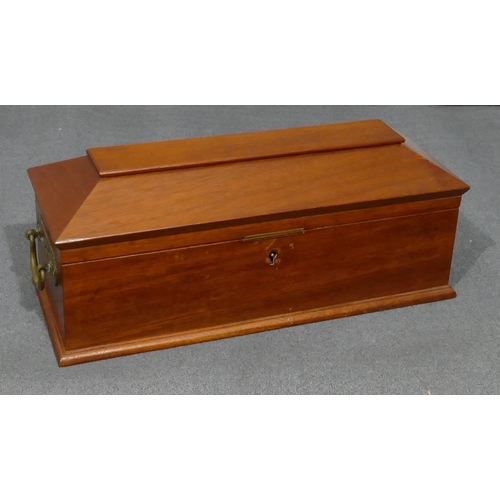 629 - An Edwardian mahogany long sarcophagus shaped tea caddy with hinged lid, enclosing 2 lidded compartm... 