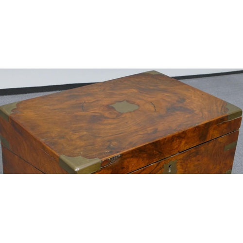 631 - A burr walnut rectangular shaped writing box with brass mounts and corners, hinged top enclosing wri... 