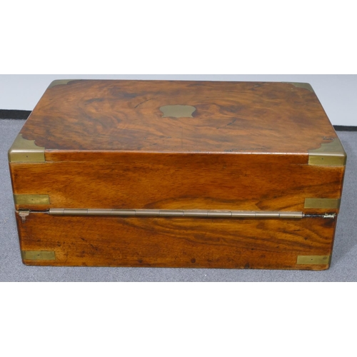 631 - A burr walnut rectangular shaped writing box with brass mounts and corners, hinged top enclosing wri... 