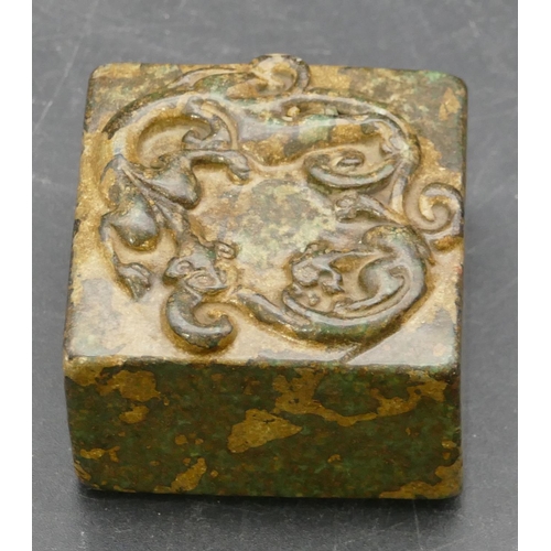 644 - A square hardstone seal with raised scroll top, 4.5cm wide.