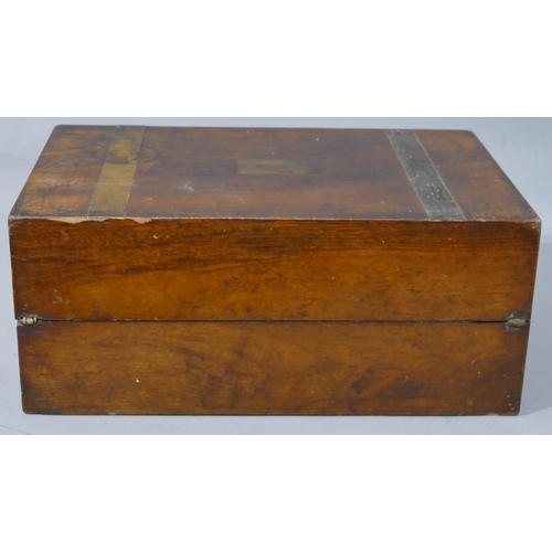 646 - A 19th Century walnut rectangular shaped writing box with gilt metal bands (1 missing), hinged lid e... 