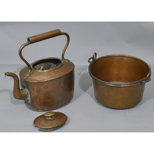 647 - A copper round pan with wrought ironed swing overhead handle, 27.5cm wide, an oval copper kettle wit... 