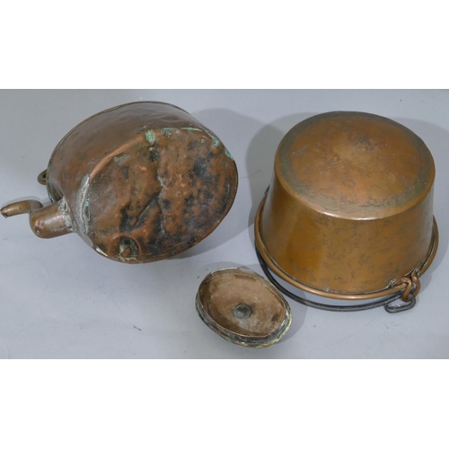 647 - A copper round pan with wrought ironed swing overhead handle, 27.5cm wide, an oval copper kettle wit... 