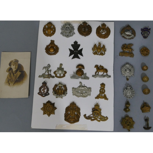 649 - A quantity of various military and other cap badges etc 