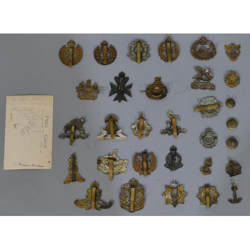 649 - A quantity of various military and other cap badges etc 