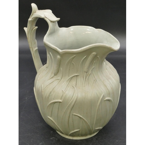 65 - A 19th Century round bulbous shaped jug on pale green ground with raised leaf decoration, 22.5cm hig... 