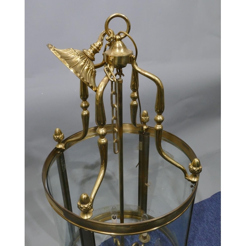 650 - A reproduction large gilt metal circular hanging hall lantern with glass sides, turned acorn motifs,... 