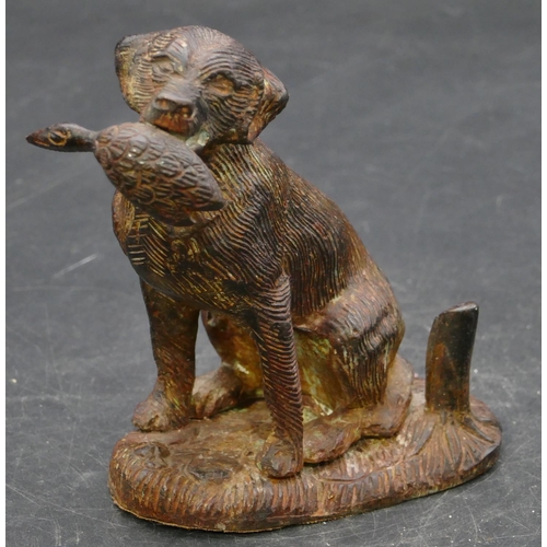 654 - A bronzed figure of a seated hunting dog, 12.5cm high.