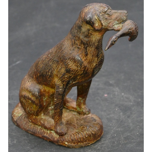 654 - A bronzed figure of a seated hunting dog, 12.5cm high.