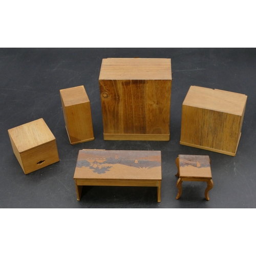 658 - A Japanese softwood miniature dolls house chest of drawers with metal mounts, 10cm high, a similar c... 