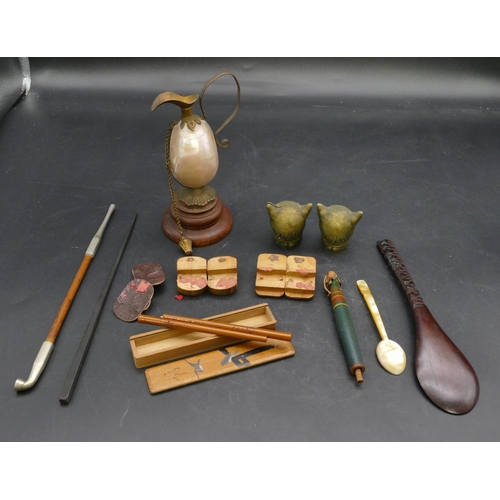 661 - 3 pairs of miniature dolls house shoes, an opium pipe, a carved wooden spoon, 2 metal cat head motif... 