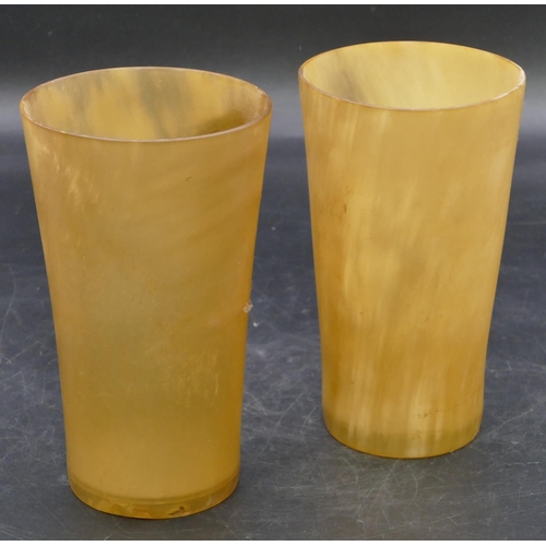 666 - A pair of horn round trumpet shaped beakers with clear bases, 15.5cm high.