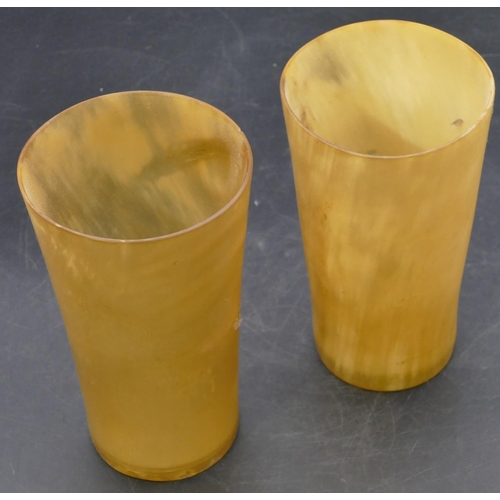 666 - A pair of horn round trumpet shaped beakers with clear bases, 15.5cm high.