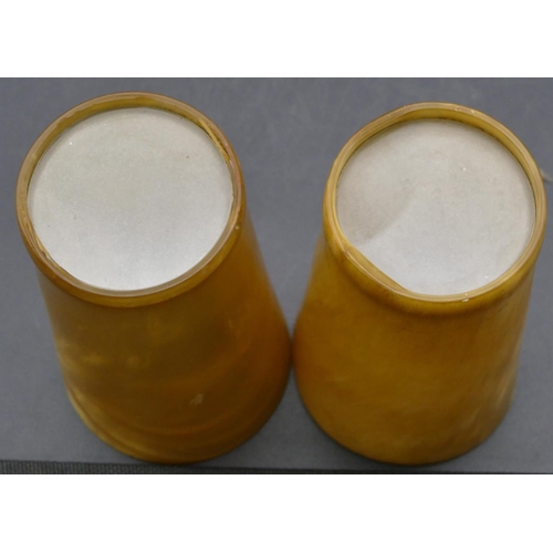 666 - A pair of horn round trumpet shaped beakers with clear bases, 15.5cm high.