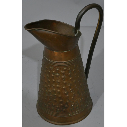 667 - R Perry, Wolverhampton copper round jug with embossed studded decoration, 31cm high.