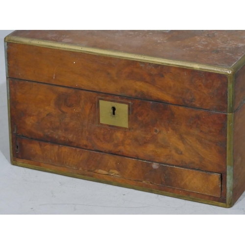 673 - A 19th Century walnut rectangular shaped dressing table box with allover brass banding and mounts, h... 