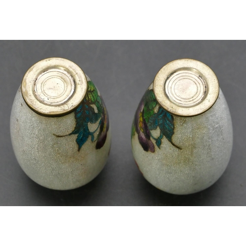 674 - A pair of Oriental small enamelled round bulbous thin necked vases on white ground with multi-colour... 