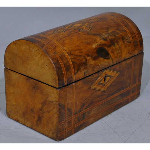 677 - A Victorian walnut dome topped stationery box with inlaid boxing and banding, hinged lid enclosing 2... 