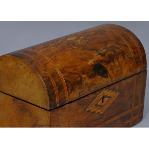 677 - A Victorian walnut dome topped stationery box with inlaid boxing and banding, hinged lid enclosing 2... 