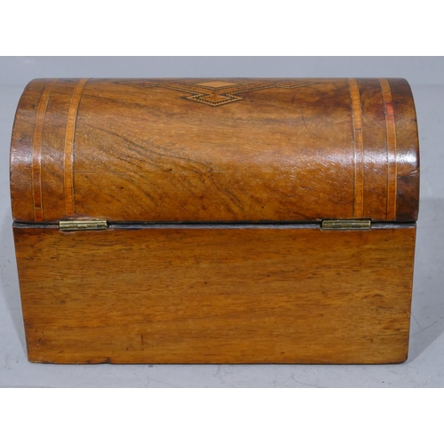 677 - A Victorian walnut dome topped stationery box with inlaid boxing and banding, hinged lid enclosing 2... 