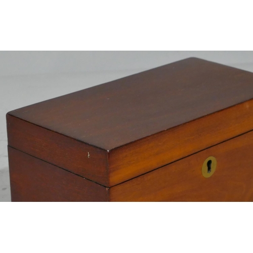 678 - A 19th Century mahogany rectangular shaped tea caddy with hinged lid enclosing 2 lidded compartments... 