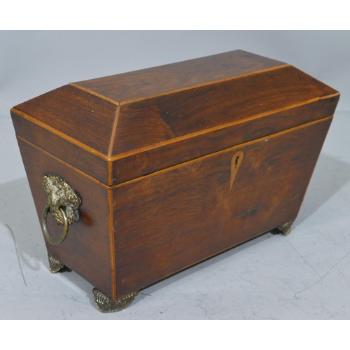 679 - A 19th Century rosewood sarcophagus shaped tea caddy with part inlaid banding, hinged lid enclosing ... 