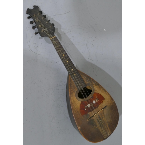 680 - A rosewood mandolin with inlaid Mother of Pearl and tortoiseshell decoration (split to back), cased.