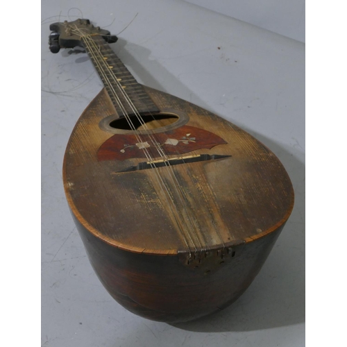 680 - A rosewood mandolin with inlaid Mother of Pearl and tortoiseshell decoration (split to back), cased.