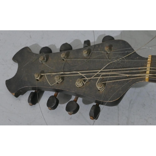 680 - A rosewood mandolin with inlaid Mother of Pearl and tortoiseshell decoration (split to back), cased.