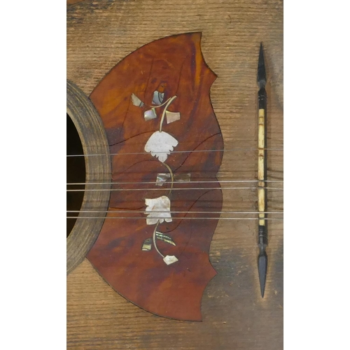 680 - A rosewood mandolin with inlaid Mother of Pearl and tortoiseshell decoration (split to back), cased.