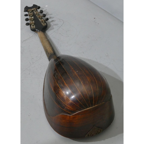 680 - A rosewood mandolin with inlaid Mother of Pearl and tortoiseshell decoration (split to back), cased.