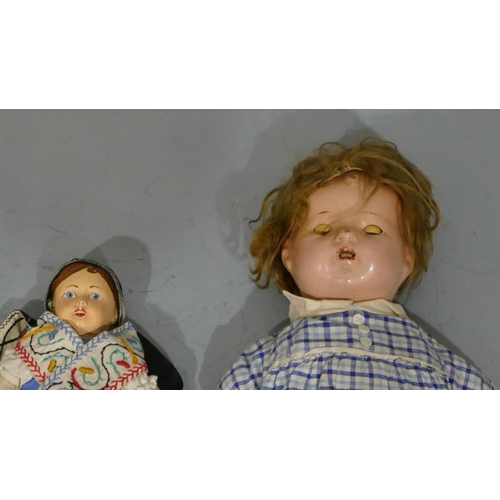 683 - A Canadian child's doll with closable eyes and open mouth, 43cm high, a Dura child's doll, 33cm high... 