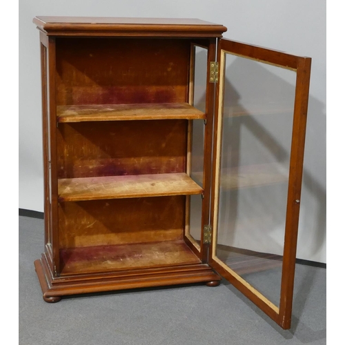 693 - A 19th Century mahogany tabletop display cabinet with glass panel door and sides, enclosing shelves,... 