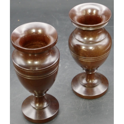 694 - A pair of Treen round bulbous thin necked trumpet shaped vases on turned bases, 18cm high