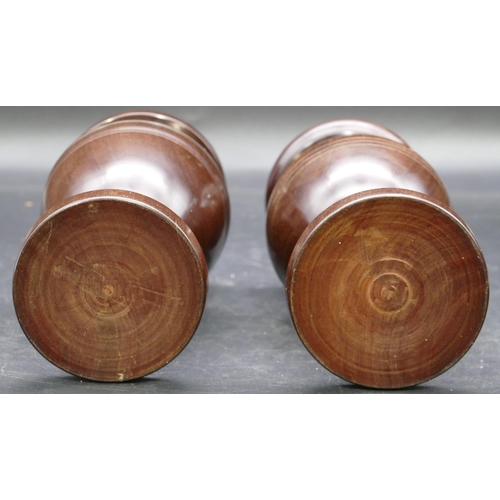 694 - A pair of Treen round bulbous thin necked trumpet shaped vases on turned bases, 18cm high